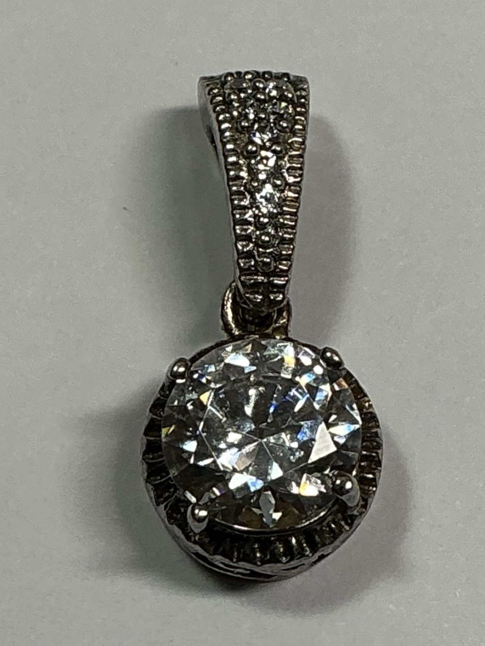 Sterling Silver Pendant with clear stones. 7/8 inches long